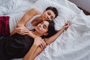 Two women sleeping together
